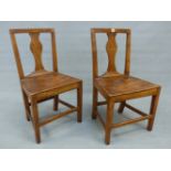 A PAIR OF GEORGIAN COUNTRY OAK SIDE CHAIRS WITH BALUSTER SPLATS, SOLID SEATS AND TAPERING SQUARE