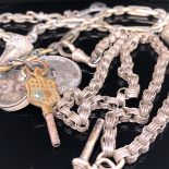 AN ANTIQUE SILVER WATCH CHAIN COMPLETE WITH T-BAR AND PART FOB. LENGTH 38.5cms, WEIGHT 29.3grms,