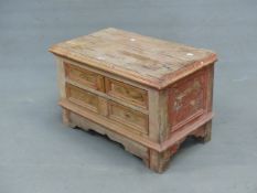 A 19th C. PINE TWO DRAWER CHEST WITH WAVY APRON AND SQUARE SECTIONED FEET, ONCE PAINTED IN