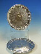 A PAIR OF VICTORIAN HALLMARKED SIILVER FOOTED SALVERS WITH SHAPED EDGE AND ENGRAVED DECORATION.