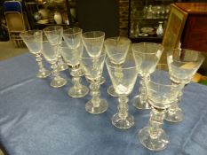 A SET OF TWELVE WINE GLASSES, EACH CONICAL BOWL ON A STEM WITH HOLLOW BALL CENTRAL TO DISC KNOPS,