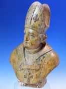 AN 18th/19th C. LIMEWOOD BUST OF A BISHOP, HIS COPE AND MITRE WITH TRACES OF GREEN DECORATION, HIS