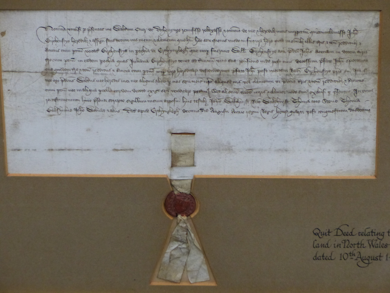 A FRAMED QUIT DEED RELATING TO LAND IN NORTH WALES DATED 10TH AUGUST 1411 AND TIED WITH A RED WAX