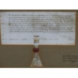 A FRAMED QUIT DEED RELATING TO LAND IN NORTH WALES DATED 10TH AUGUST 1411 AND TIED WITH A RED WAX