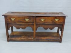 A 19th C. OAK DRESSER, THE RECTANGULAR TOP OVER TWO DRAWERS AND OPEN POT BOARD BETWEEN THE STILE
