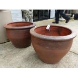 PAIR OF LARGE STONEWARE GARDEN POTS. D. 54 x H. 40cms, TOGETHER WITH AN ANTIQUE CARVED STONE PLANTER