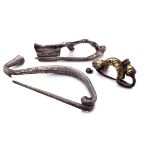 THREE ROMAN WHITE METAL CROSSBOW BROOCHES, THE LARGEST OF SINUOUS FORM. H 5.5cms. THE SMALLEST