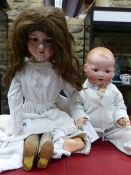 TWO ARMAND MARSEILLE BISQUE HEADED DOLLS, THE 390. H 66cms. AND MY DREAM BABY. H 55cms.