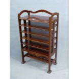 AN ARTS AND CRAFTS STYLE MAHOGANY MUSIC SHELF IN THE MANNER OF SHOOLBRED. 56cm x 31cm x 93cm (H).