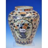 AN 18th C. JAPANESE IMARI OVOID JAR PAINTED WITH THREE RESERVES OF CHRYSANTHEMUMS ON A BAMBOO AND