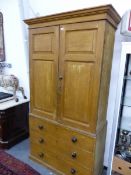 A 19TH C PINE LINEN PRESS PAINTED IN OCHRE WITH FAUX BOIS GRAINING, THE DOORS TO THE TOP ENCLOSING