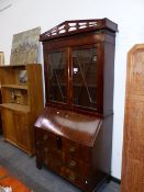 A LATE GEORGIAN MAHOGANY BUREAU BOOKCASE WITH PIERCED CORNICE OVER GLAZED DOORS, THE FALL WITH