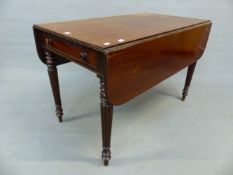 A 19th C. MAHOGANY PEMBROKE TABLE WITH A DRAWER TO ONE END ABOVE REEDED TAPERING CYLINDRICAL LEGS.