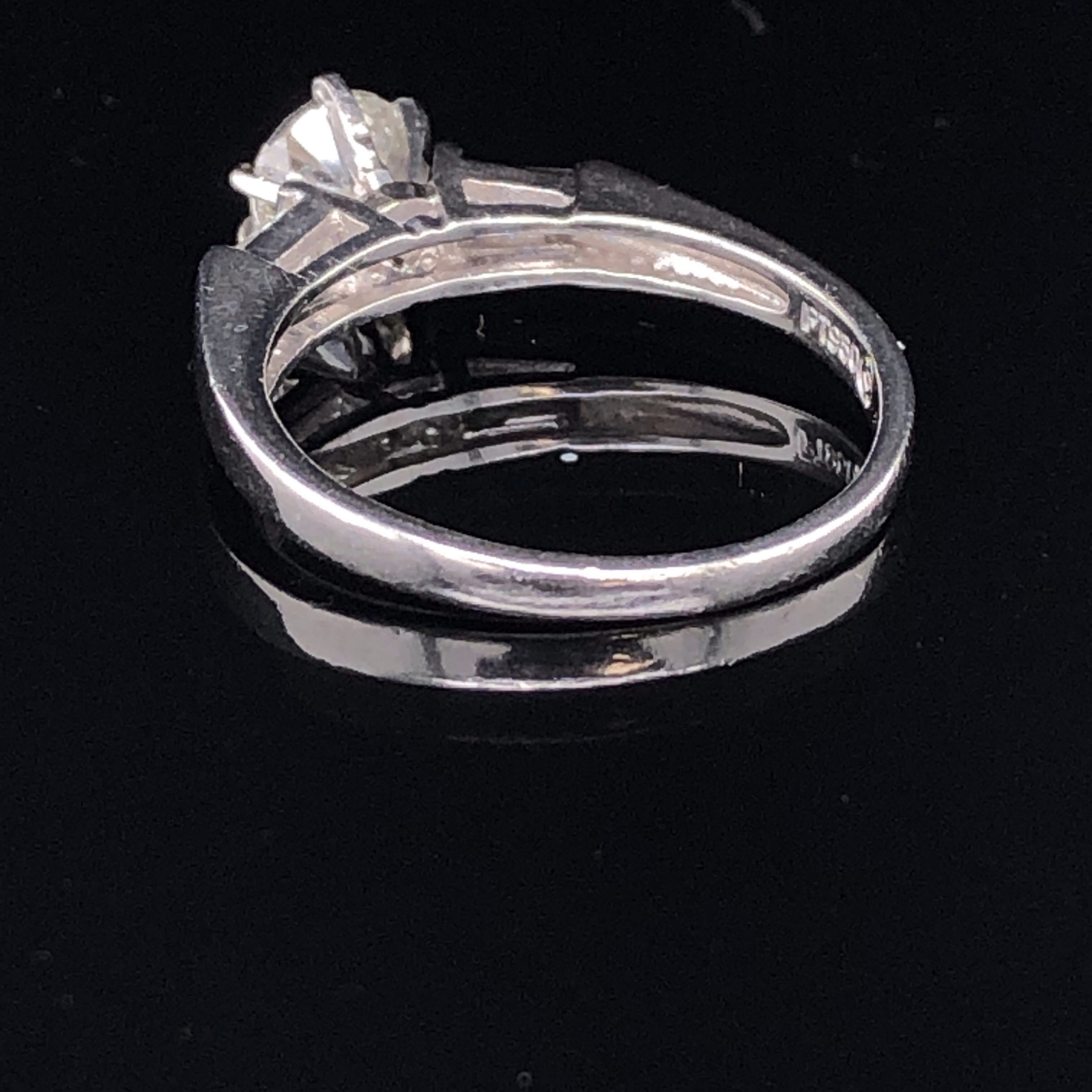 A PLATINUM AND DIAMOND TRILOGY RING. THE CENTRAL DIAMOND APPROX. ESTIMATED WEIGHT 0.70cts, I/SI2/3 - Image 2 of 4