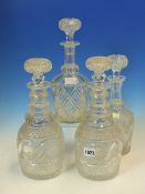 A PAIR OF TRIPLE RING NECKED DECANTERS AND STOPPERS, POSSIBLY WATERFORD, THE MALLET SHAPED BODIES