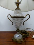 TWO SIMILAR BRASS MOUNTED CUT GLASS TWO HANDLED URN SHAPED TABLE LAMPS ON SQUARE FEET. H 40cms.