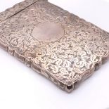 A SILVER VISITING CARD CASE, BIRMINGHAM 1897, CHASED WITH FOLIAGE SCROLLING ABOUT THE BLANK ROUNDELS