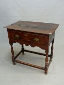 AN 18th C. OAK SIDE TABLE, THE TWO PLANK TOP OVER A DRAWER, THE WAVY APRON AND BALUSTER TURNED