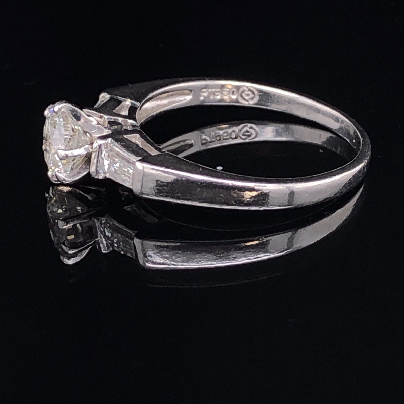 A PLATINUM AND DIAMOND TRILOGY RING. THE CENTRAL DIAMOND APPROX. ESTIMATED WEIGHT 0.70cts, I/SI2/3 - Image 3 of 4