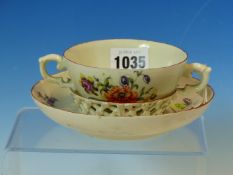 AN 18th C. TWO HANDLED TREMBLEUSE CUP AND SAUCER, PROBABLY GERMAN, PAINTED WITH SPRIGS OF FLOWERS