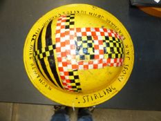 A VINTAGE ARP HELMET, LATER REPURPOSED AS A MARSHALS HELMET- PAINTED YELLOW AND INSCRIBED WITH