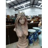 AN ART NOUVEAU STYLE TERRACOTTA COLOURED COMPOSTION BUST OF A LADY ON PLINTH BASE, HER CROWN SET WIT