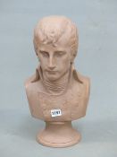 A TERRACOTTA COLOUR COMPOSITION BUST OF NAPOLEON AFTER THAT CARVED BY CANOVA IN 1808. H 43cms.