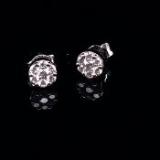 A PAIR OF 18ct WHITE GOLD MULTI DIAMOND STUD EARRINGS. ESTIMATED APPROX DIAMOND WEIGHT 0.50cts.