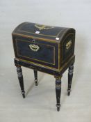 AN EBONISED AND GILT BANDED 19TH CENTURY BOX, A CENTRAL BRASS CARTOUCHE TO THE ROUND ARCHED LID, BR