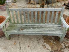 A WEATHERED TEAK GARDEN BENCH, BY LISTER.