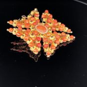 A 20ct GOLD AND CORAL MALTESE CROSS. MEASUREMENTS APPROX 4cms X 4cms. WEIGHT 6grms.