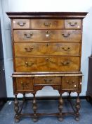 AN 18th.C. AND LATER WALNUT CHEST ON STAND OF THREE SHORT AND THREE LONG GRADUATED DRAWERS OVER A