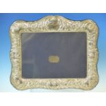 A HALLMARKED SILVER EMBOSSED PHOTOGRAPH FRAME WITH BLUE VELVET BACK, DATED 1996 SHEFFIELD, FOR