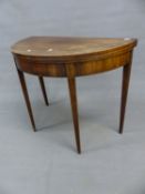 A REGENCY MAHOGANY AND BOXWOOD BANDED DEMI LUNE FOLD OVER CARD TABLE ON SQUARE TAPERED AND FLUTED