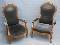 A NEAR PAIR OF FRENCH WALNUT 19th.C. SHOW FRAME OPEN ARM SALON CHAIRS ON SHAPED FORELEGS.