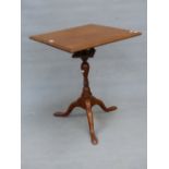 AN ANTIQUE MAHOGANY BIRDCAGE TABLE, THE SQUARE TOP TILTING ON THE BALUSTER COLUMN AND TRIPOD WITH