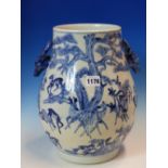 A CHINESE BLUE AND WHITE VASE PAINTED WITH DEER BELOW PINE TREES AND WITH STAGS HEAD HANDLES, SIX