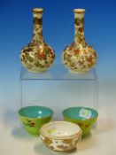 A PAIR OF SATSUMA FLORAL BOTTLE VASES. H 12.5cms. TOGETHER WITH A PAIR OF CHINESE TEA BOWLS, THE