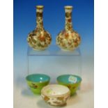 A PAIR OF SATSUMA FLORAL BOTTLE VASES. H 12.5cms. TOGETHER WITH A PAIR OF CHINESE TEA BOWLS, THE