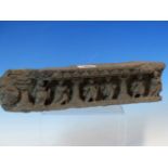 A GANDHARAN GREY SCHIST FRIEZE FRAGMENT CARVED WITH SIX FIGURES STANDING AMONGST COLUMNS. W 32.