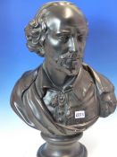 A BLACK PAINTED PLASTER BUST OF SHAKESPEARE WEARING A CLOAK OVER HIS TASSELL TIED SHIRT AND