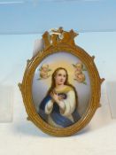 A GERMAN PORCELAIN OVAL PLAQUE PAINTED WITH THE IMMACULATE CONCEPTION OF THE MADONNA AFTER