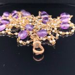 AN EDWARDIAN 14ct GOLD,CONTINUOUS PEARL AND AMETHYST TWISTED WIRE WORK NECKLACE. LENGTH 147cms.
