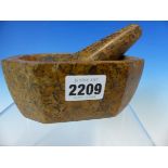 A BROWN MARBLE PESTLE AND MORTAR, THE LATTER OF CANTED RECTANGULAR SHAPE, BOTH WITH BLACK SHELL
