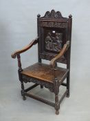 AN ANTIQUE OAK WAINSCOTT TYPE CHAIR, WITH RELIEF CARVED BACK PANEL. W. 57cm x 53cm x H. 114cm.