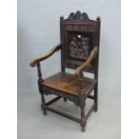 AN ANTIQUE OAK WAINSCOTT TYPE CHAIR, WITH RELIEF CARVED BACK PANEL. W. 57cm x 53cm x H. 114cm.