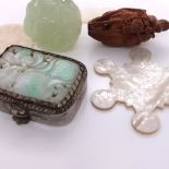 TWO CHINESE MOTHER OF PEARL COUNTERS, A STAR SHAPED SILK SPOOL, A COQUILLA NUT MONKEY RIDING A