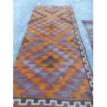 ANTIQUE BELOUCH FLAT WEAVE RUG. 222 x 155cms. TOGETHER WITH A KELIM PANEL. 350 x 138cms (2).