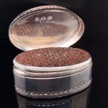 A GEORGIAN SILVER NUTMEG GRATER OF NAVETTE FORM, WITH REPEATING SCROLLS AROUND THE COVER AND A