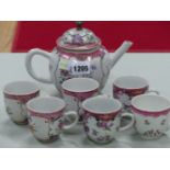 A CHINESE EXPORT FLORAL TEA POT, THREE COFFEE CUPS EN SUITE, A PAIR AND ONE OTHER COFFEE CUP, ALL